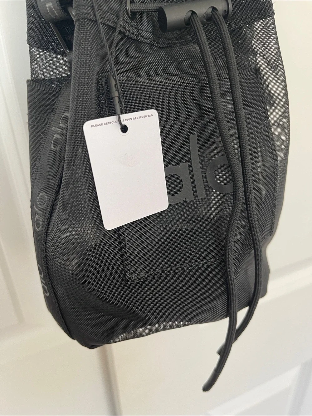 ALO Black Sheer Mesh Bucket Crossbody Bag with drawstring closure